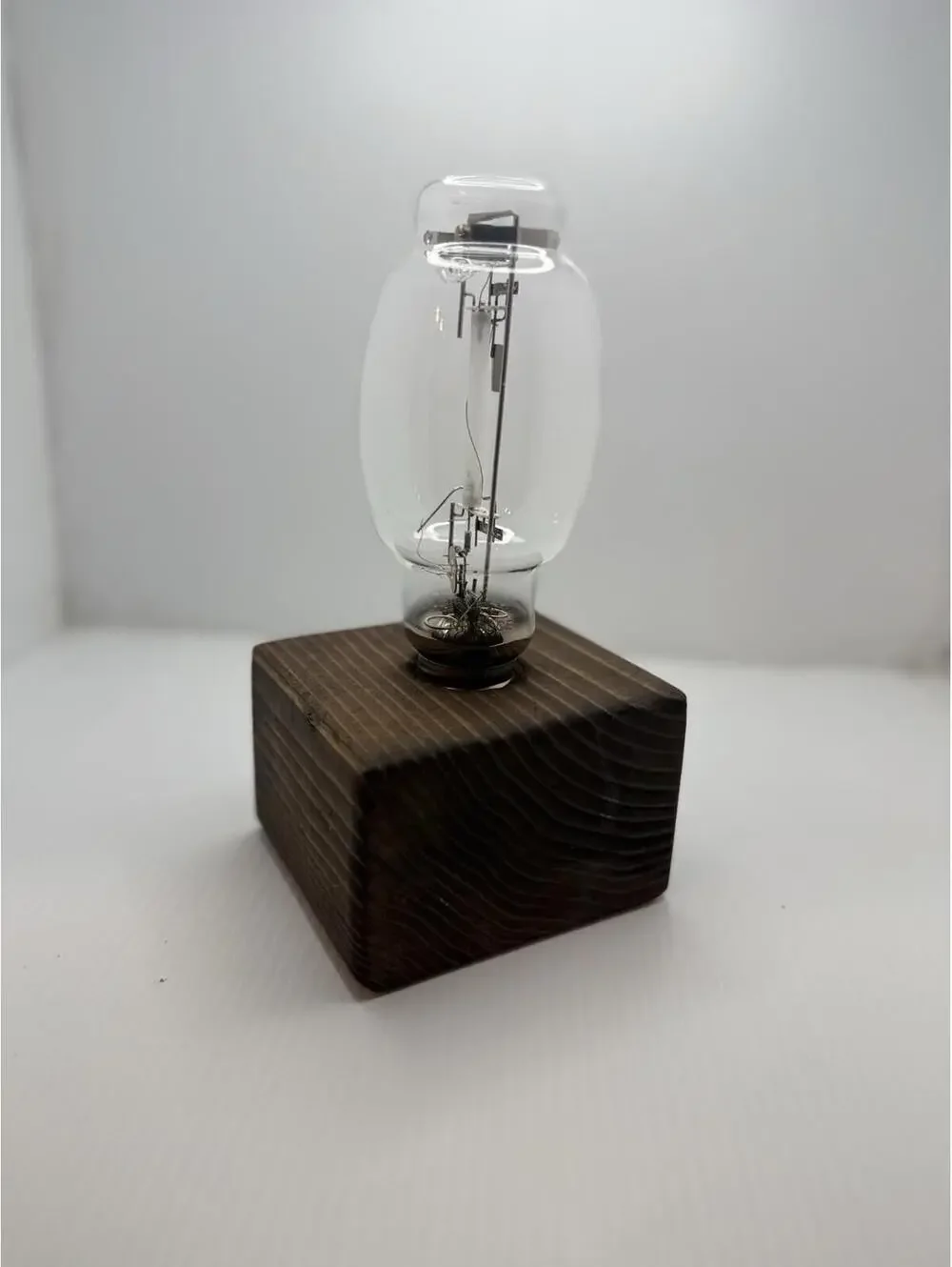 Vintage Retro High Pressure Sodium Industrial Bulb Display on Wood Pedestal